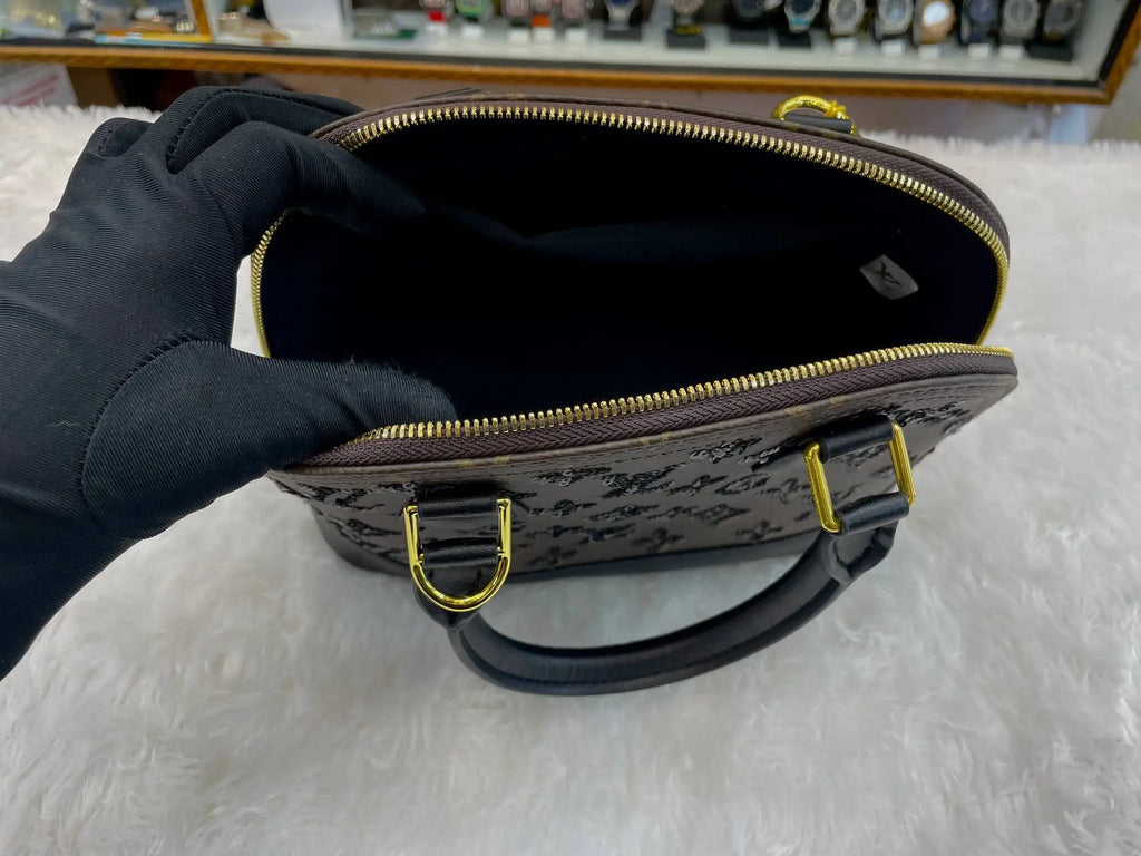 Louis vuitton (lv) monogram eclipse alma bb bag in master piece