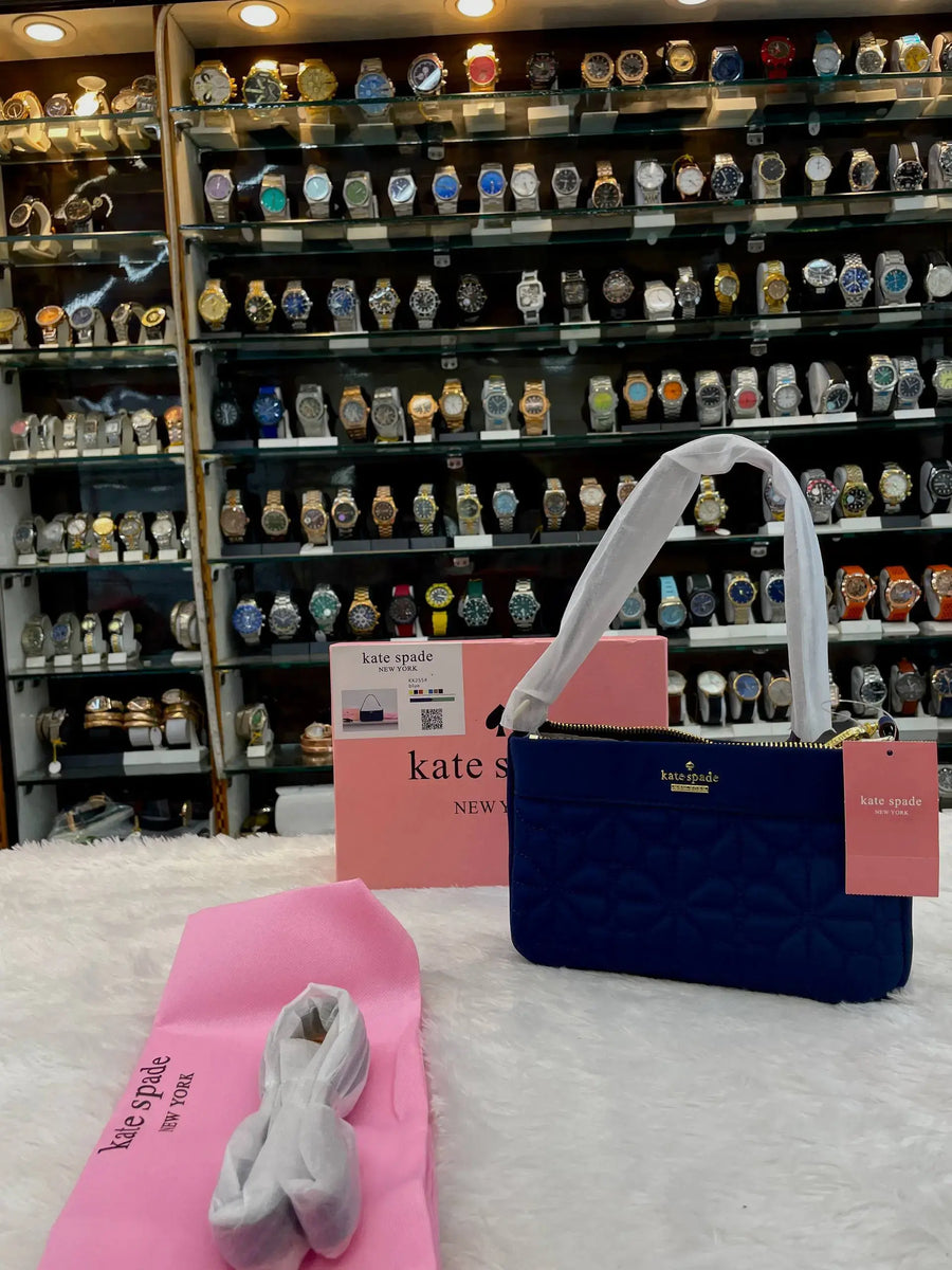Kate spade new york flower quilted sling bag
