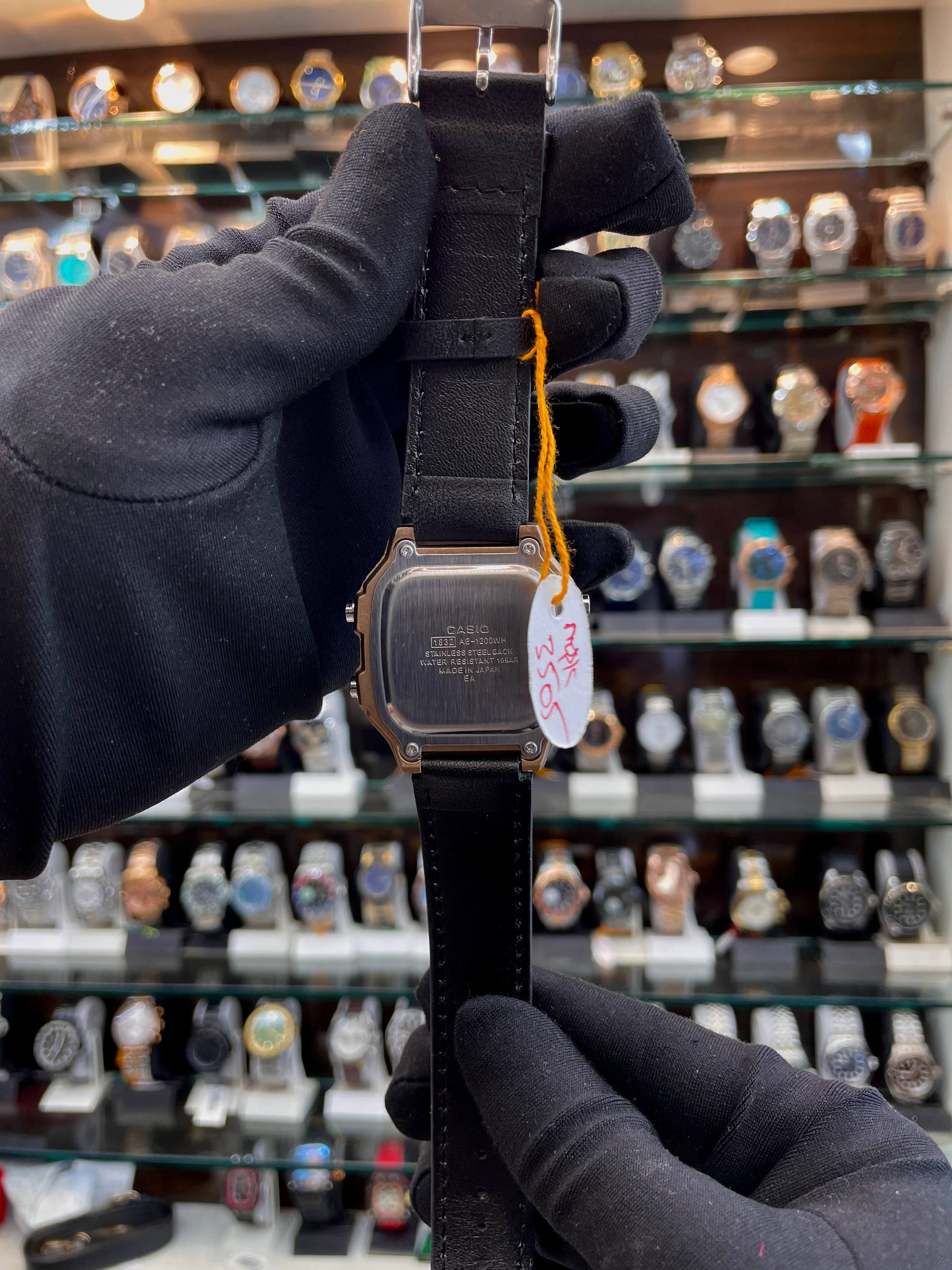 Casio AE-1200WH-1A black leather digital watch back view