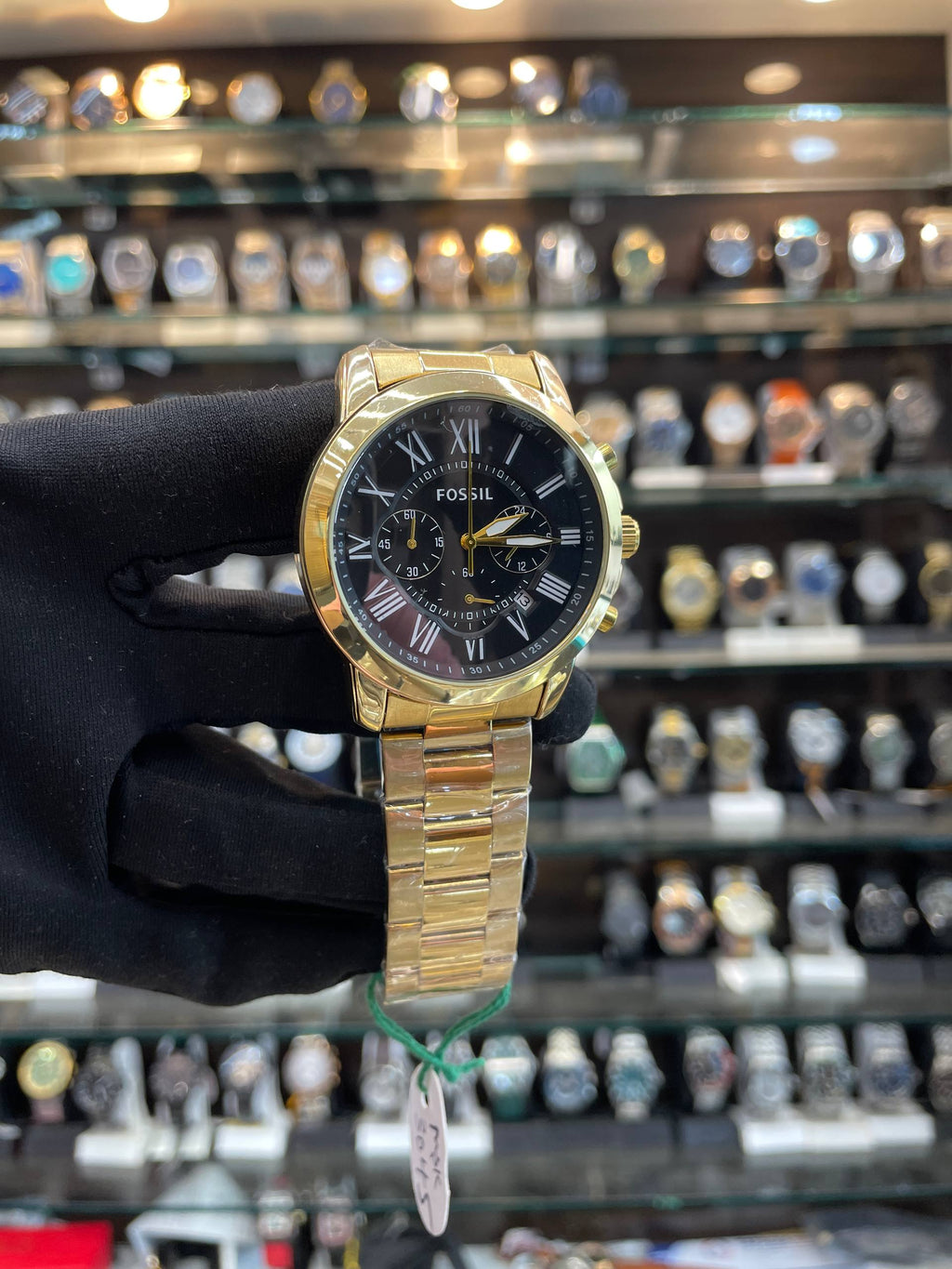 Fossil Roman dial chain watch close up