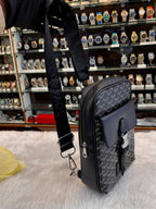 Goyard black canvas crossbody messenger bag side view