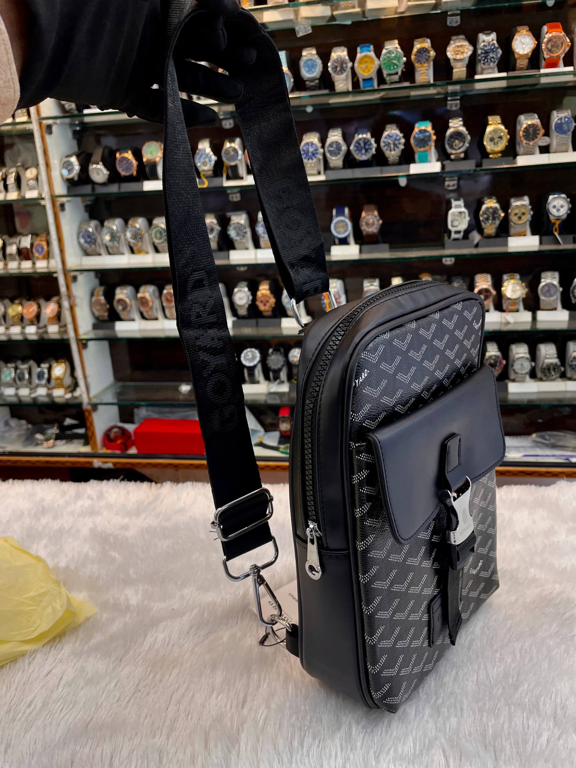 Goyard black canvas crossbody messenger bag side view