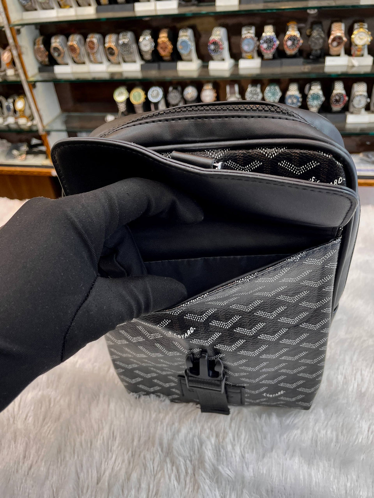 Goyard black messenger bag adjustable strap and interior detail