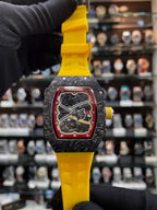 richard mille yellow silicon watch close up