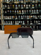 LOUIS VUITTON LV SUNGLASSES FEATURE A BLACK ACETATE FRAME