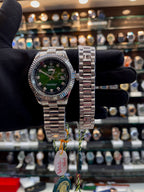 Green dial matching men's and women's watches angled view