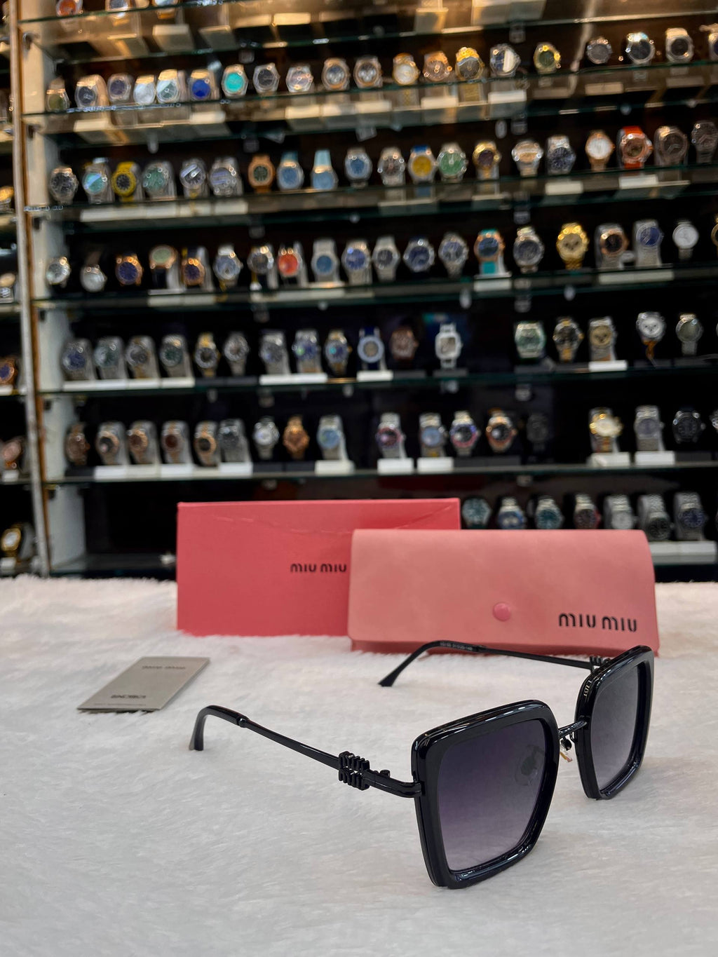 Miu Miu black oversized girls sunglasses side view