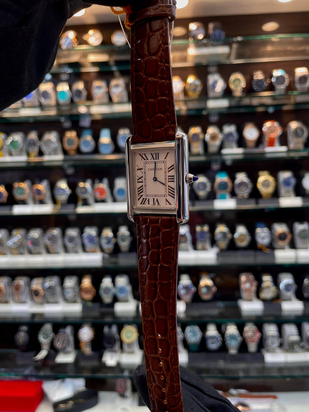 Cartier Tank brown men's watch side view