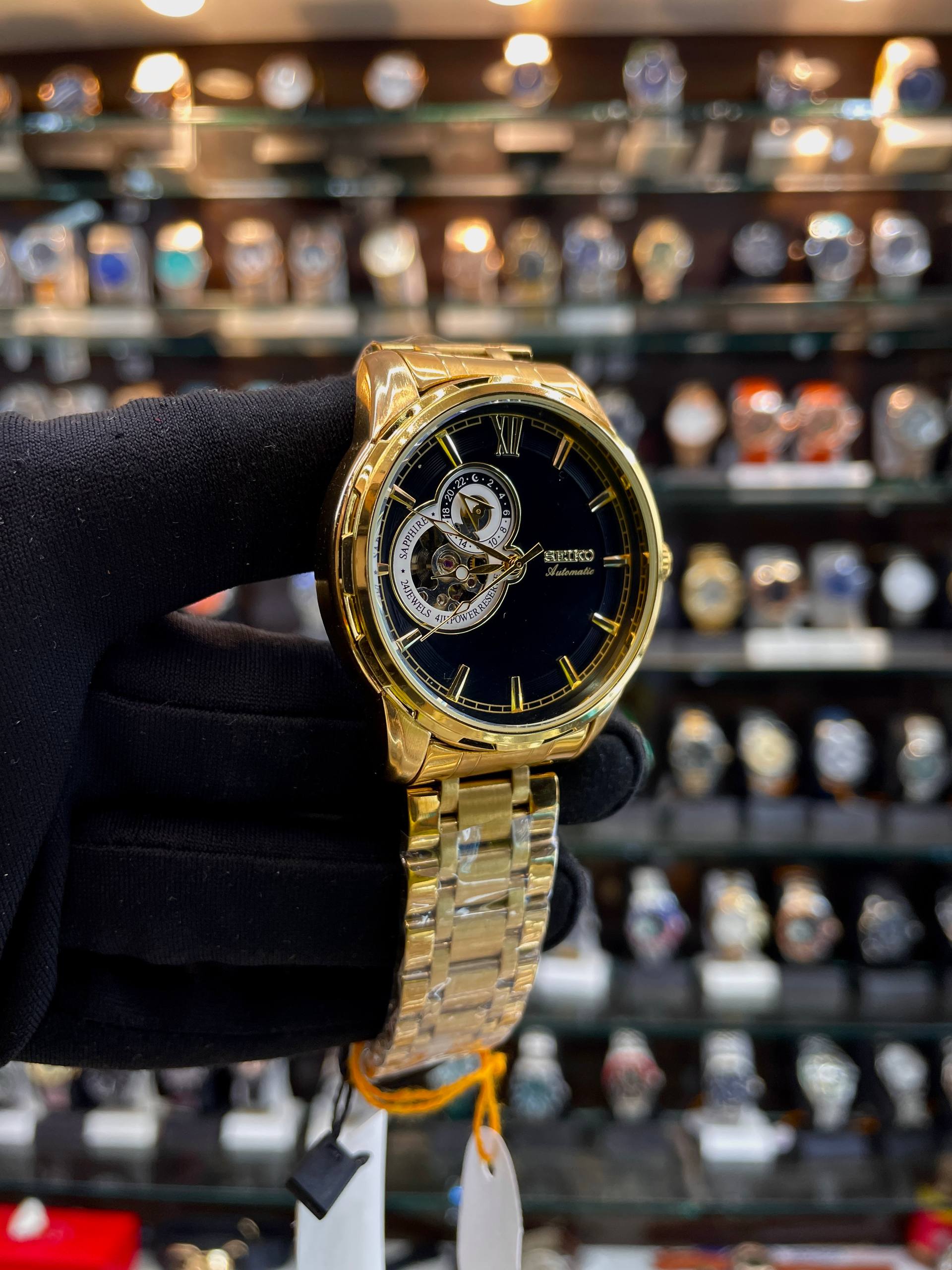 Seiko open heart black dial 24 hour watch close up