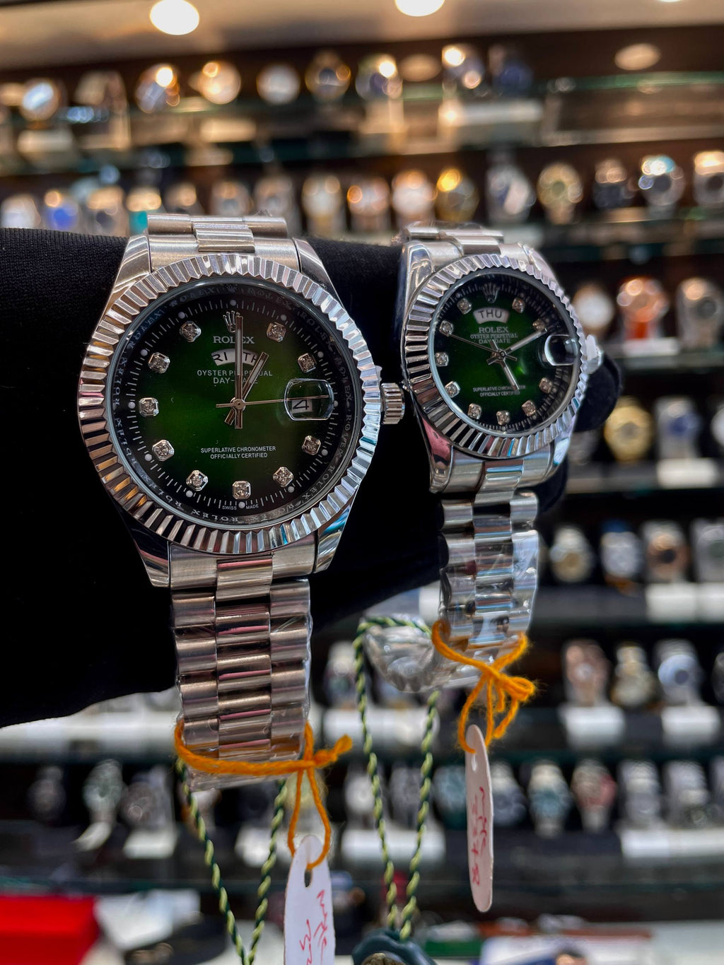 Green diamond dial matching couple watches side view