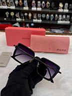 Miu Miu black square sunglasses close up