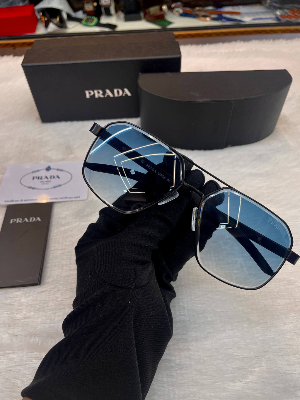 Prada Linea Rossa blue frame glasses close up