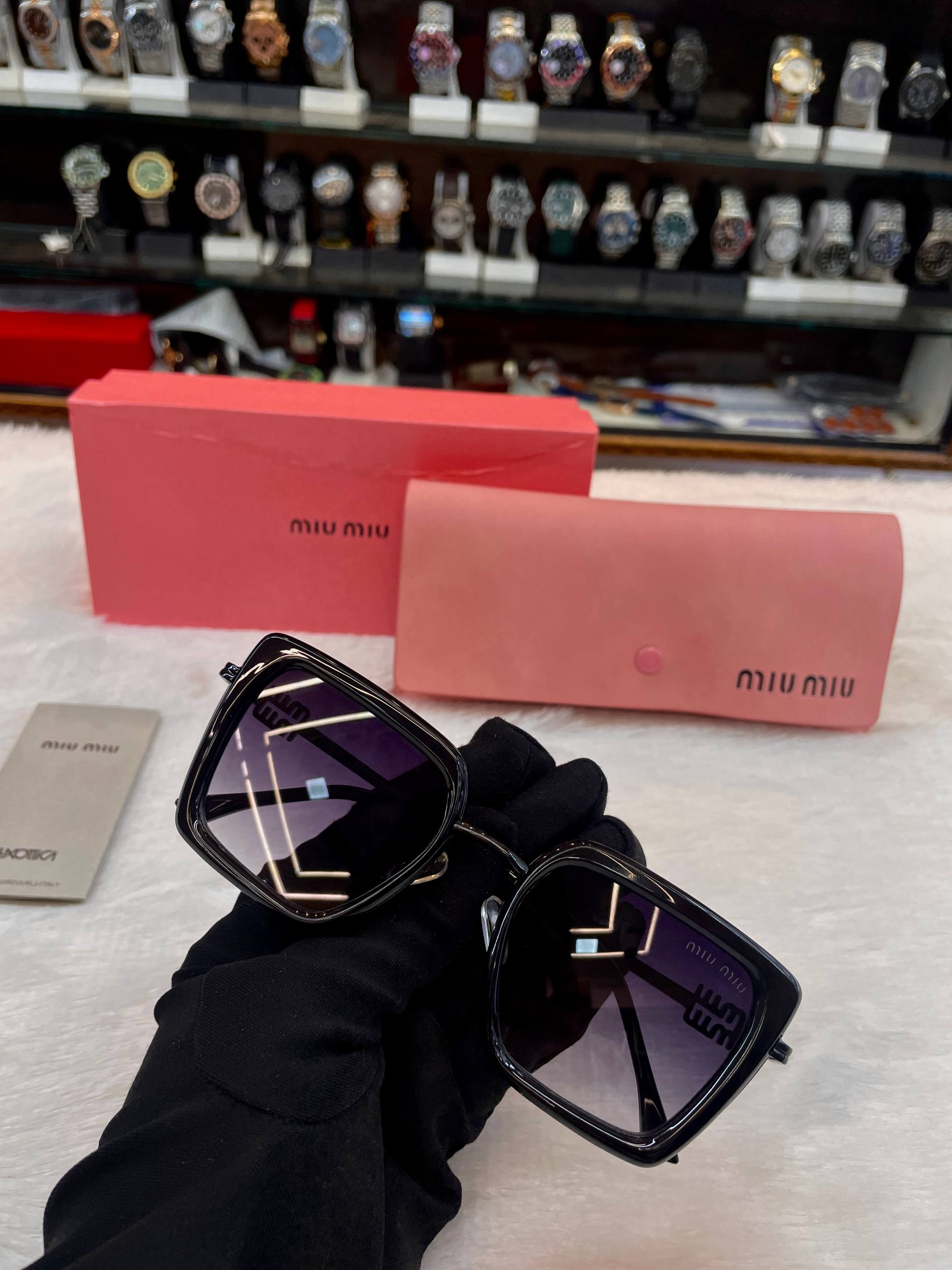 Miu Miu girls black sunglasses frame detail