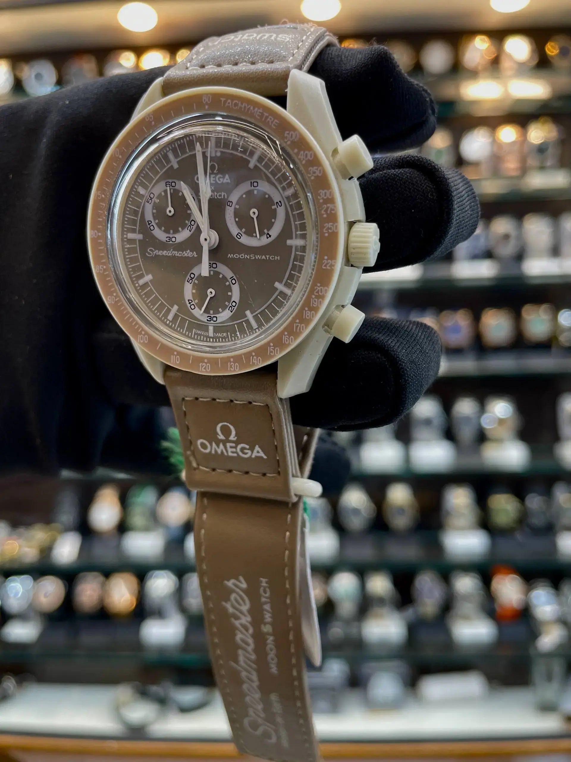 Omega swatch now under budget brown