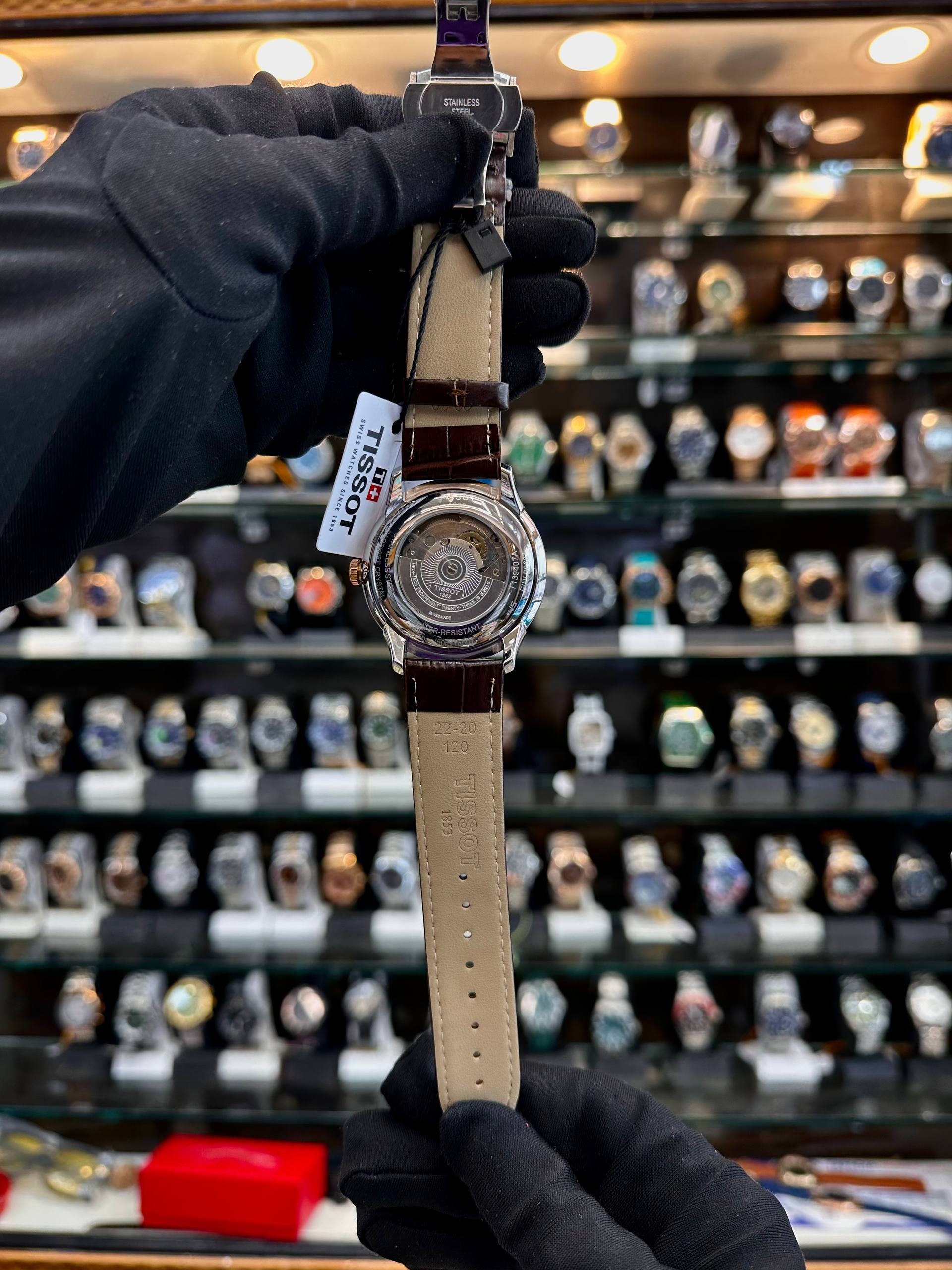 Tissot Powermatic brown watch dial back
